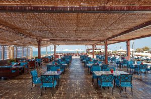 St Trop Tables Ready with Blue Chairs and Shades